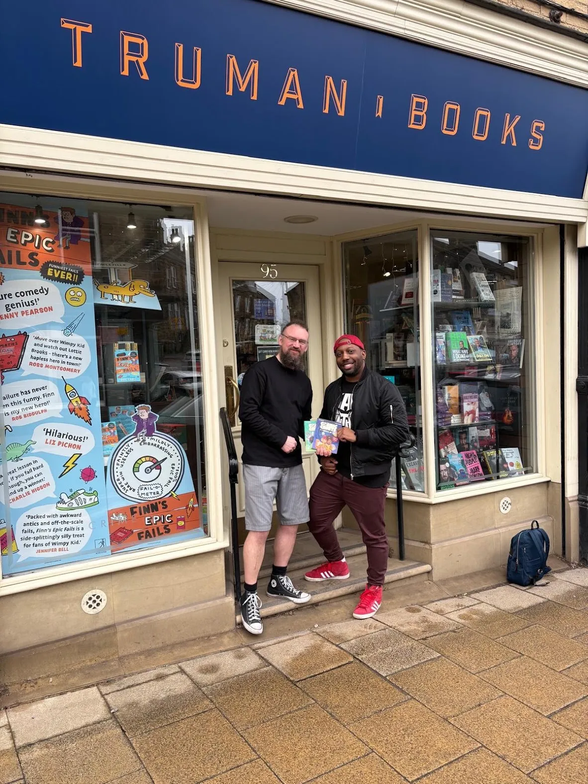 Ryan Crawford outside Truman Books in Leeds with a bookseller